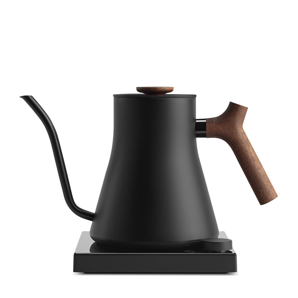 Fellow Stagg EKG Pro Studio Edition with matte black finish and walnut handle for precise, controlled pours.