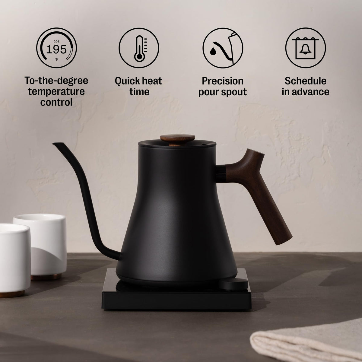 Stainless steel body with glass base and metal accents for durability and premium aesthetics.
