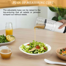 Ferrochef clear plastic 2-cup cup with easy-to-read markings for quick accuracy.