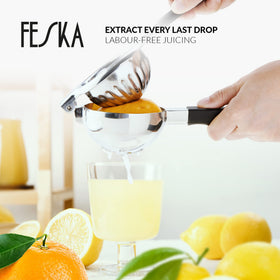 FESKA silicone-handle squeezer provides comfortable grip during quick juicing.