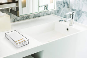 Fete acrylic napkin holder storage tray reduces counter clutter while keeping towels within easy reach.