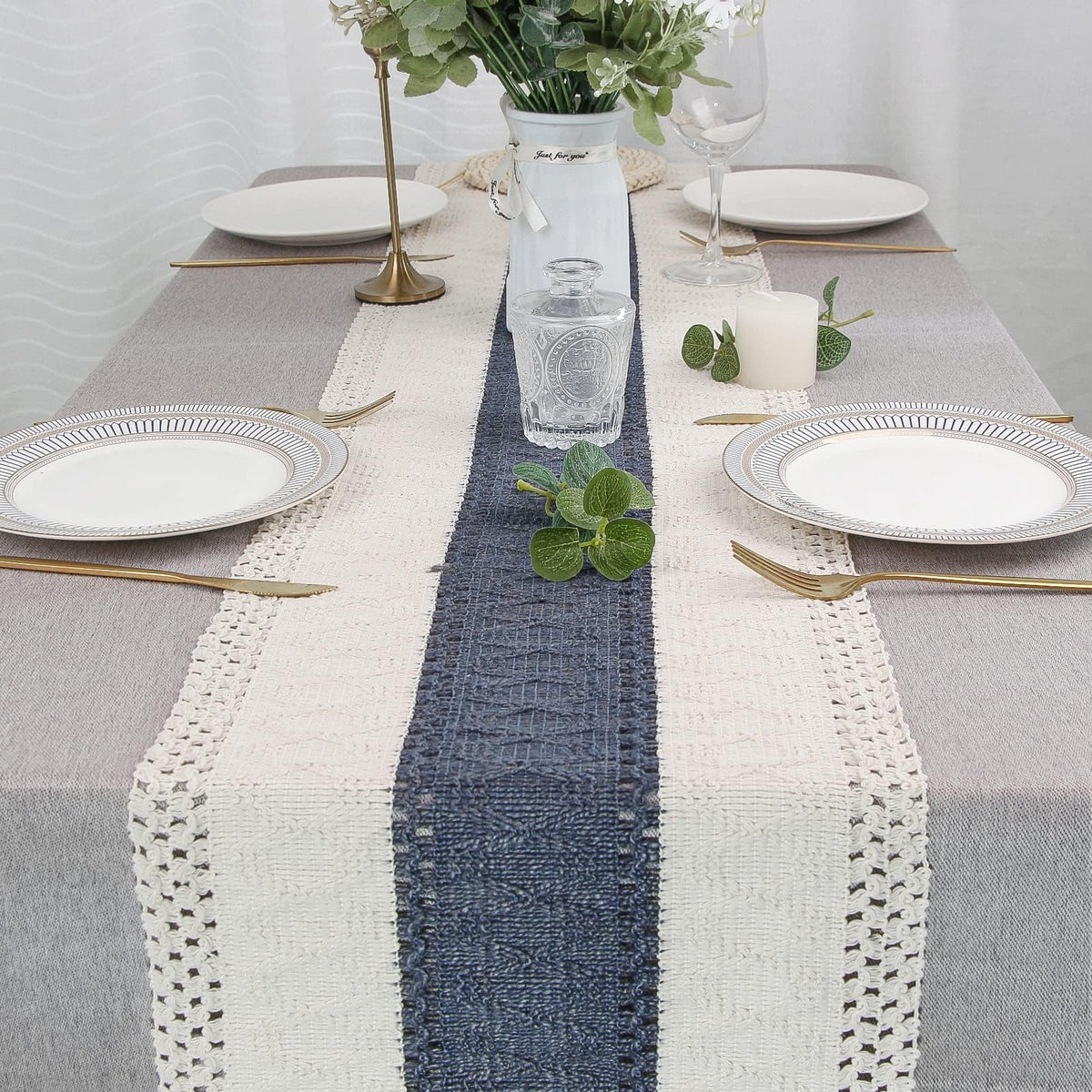 FEXIA boho table runner folded in packaging showing creases before flattening.