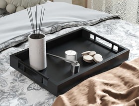 Fibogollo bamboo serving tray on a coffee table for drinks and snacks.