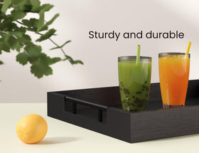 Fibogollo serving tray on a coffee table adds organized decor.