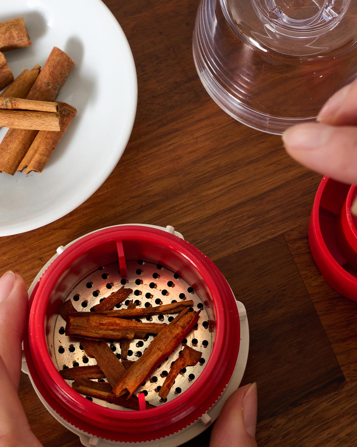 FinaMill Grater Pod beside grinders to show cross-compatibility