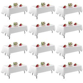 FindYou 12-pack white tablecloth 60x102 inch on a rectangular table for clean party setup.