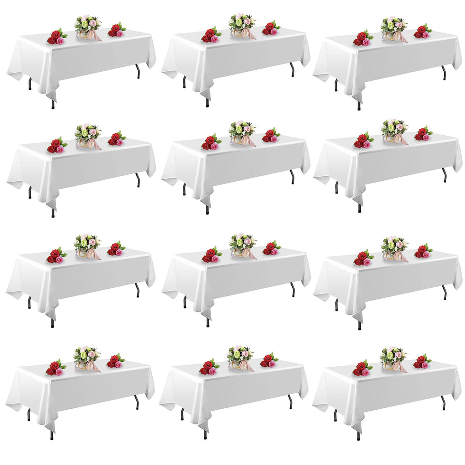 FindYou 12-pack white tablecloth 60x102 inch on a rectangular table for clean party setup.