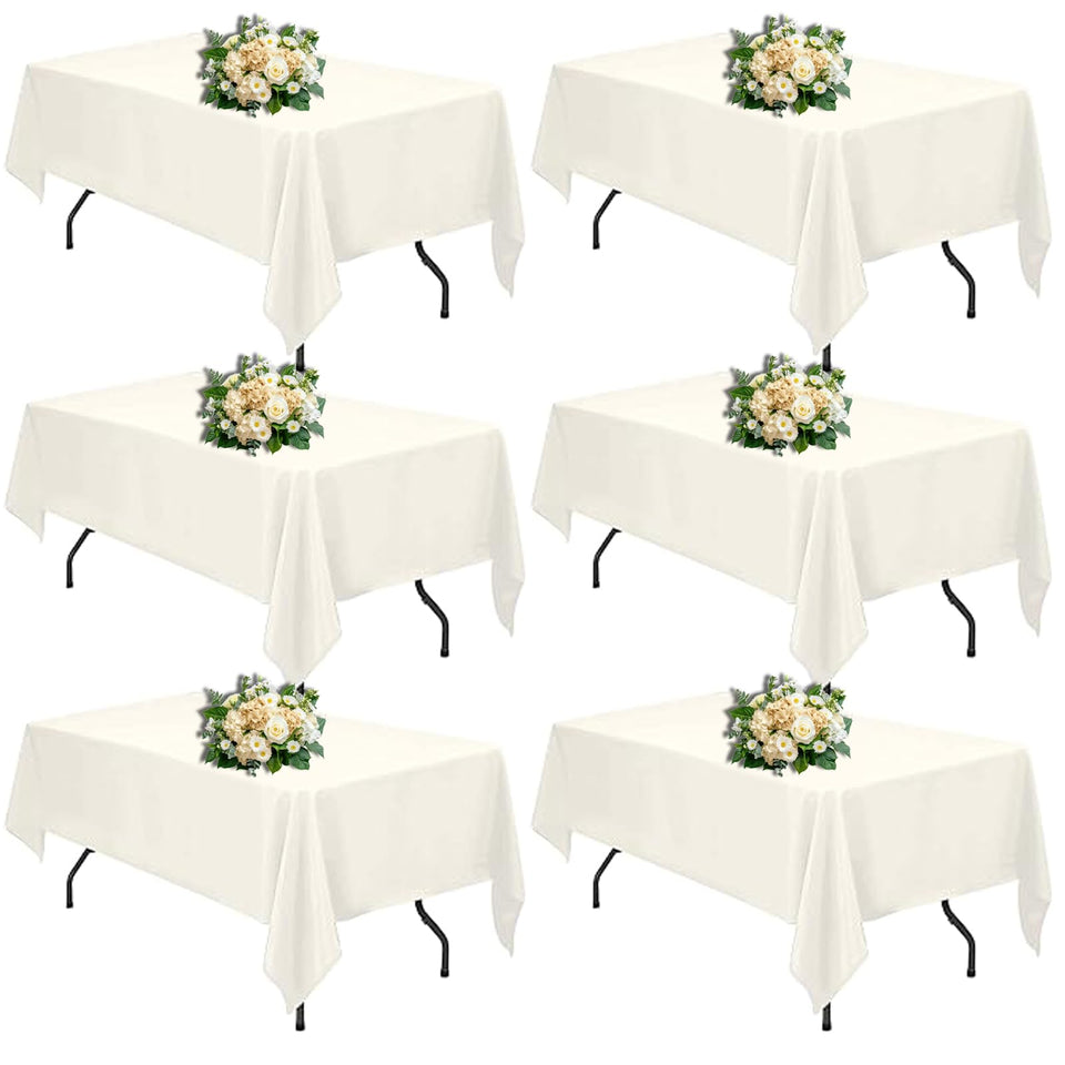 FINDYOU Ivory tablecloth on a 60x102 inch rectangle table, elegant event backdrop.
