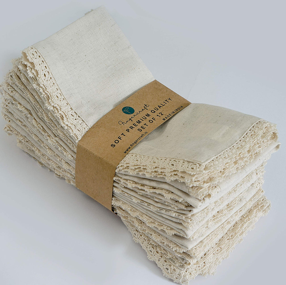 FINGERCRAFT dinner napkins with ivory lace and mitered corners for elegant table styling.