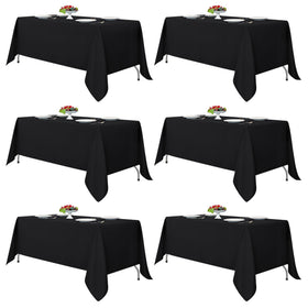 Fitable black tablecloth on a rectangle table, durable, reusable, and easy to clean.