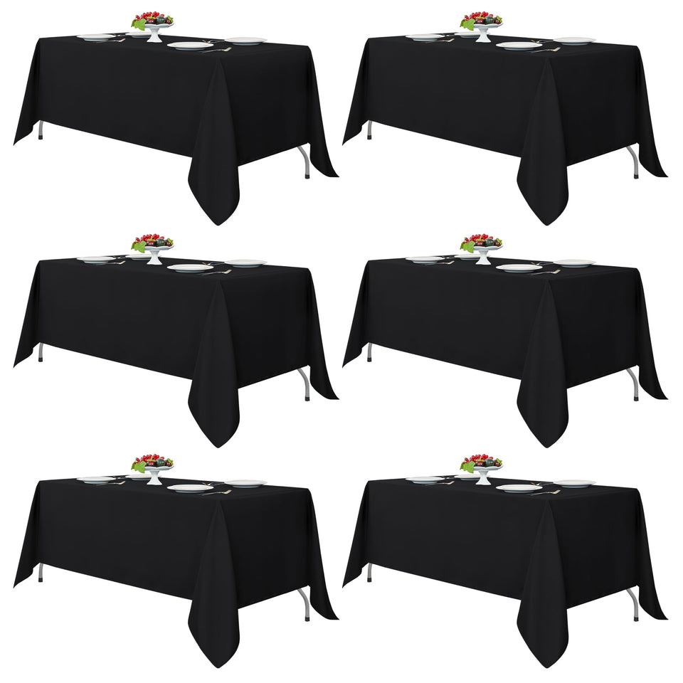 Fitable black tablecloth on a rectangle table, durable, reusable, and easy to clean.