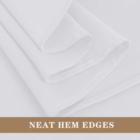 Fitable elegant white tablecloth complements wedding decor and guest seating.