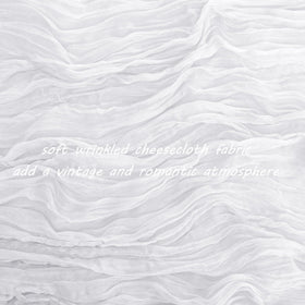 Fivenl cheesecloth runner draped across table for elegant banquet look