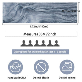 Fivenl dusty blue gauze runner drapes gracefully over banquet tables.