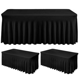 Fixwal 2-pack black spandex tablecloth skirt on a 4ft rectangle table enabling a clean setup
