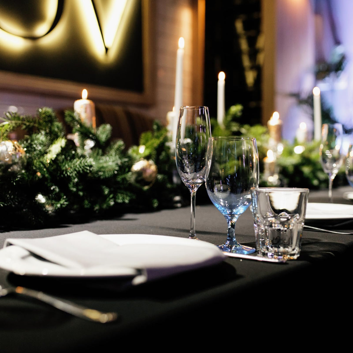 Fixwal buffet-display setup with black table cover creates sleek backdrop.