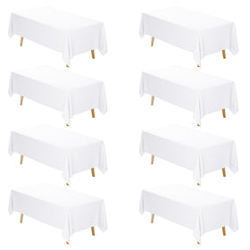 Fixwal 8-pack white tablecloth on a 6ft rectangle table protecting from dust and scratches.