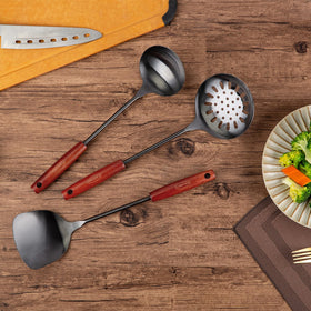 FJNATINH skimmer and spatula close-up highlighting precise control during stir-frying.