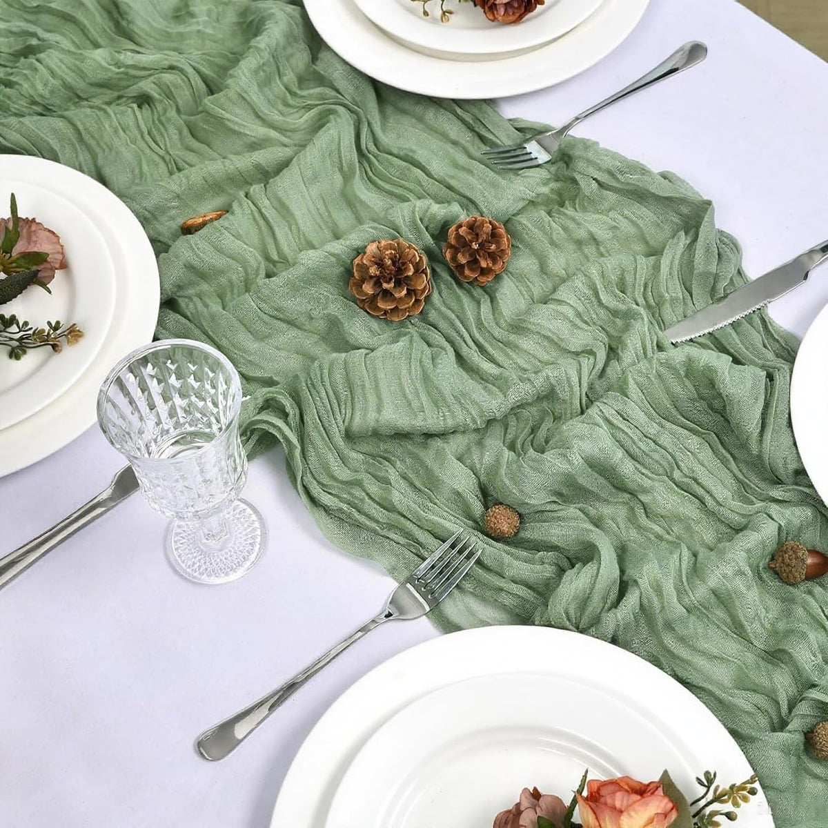 FlashCarryPro sage green cheesecloth runner on table highlighting delicate centerpieces