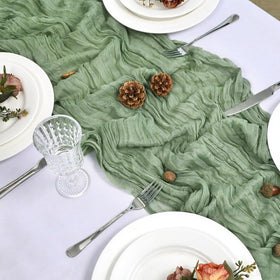 FlashCarryPro sage green cheesecloth runner on table highlighting delicate centerpieces