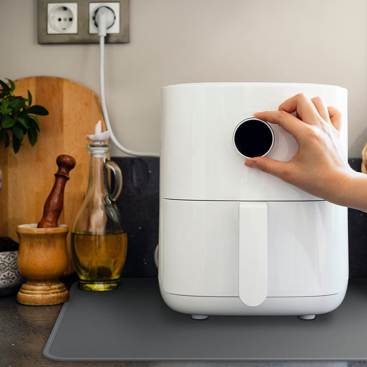 FLASLD coffee maker mat keeps spills away from countertops with easy cleanup.