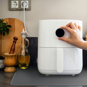 FLASLD coffee maker mat keeps spills away from countertops with easy cleanup.