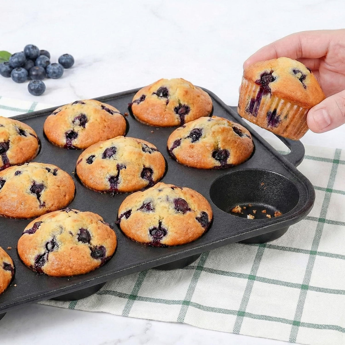 Even-heat distribution from cast iron promotes uniform browning and even muffin texture.