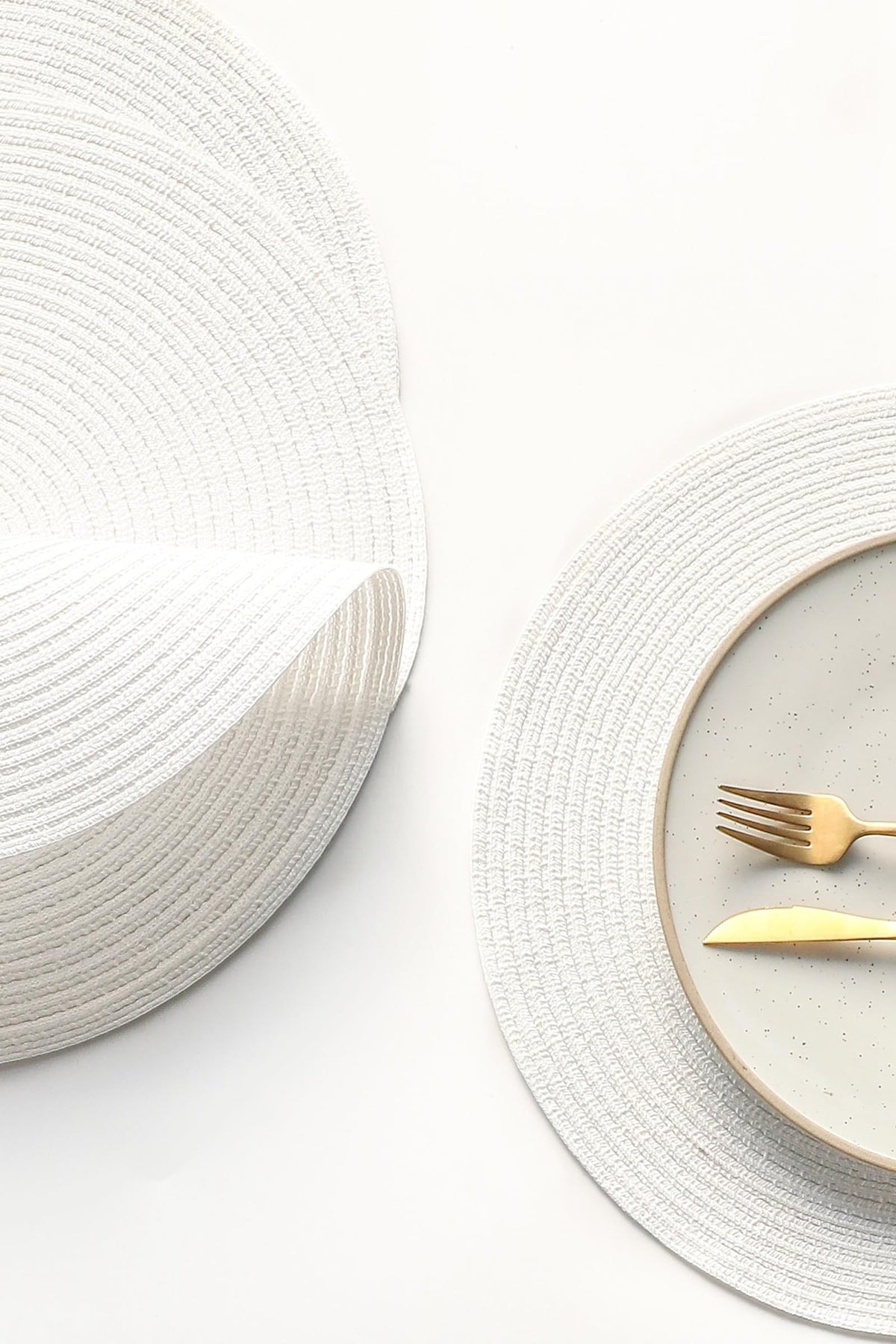 Floroom braided texture white placemats highlight durable cotton-poly blend and easy care.