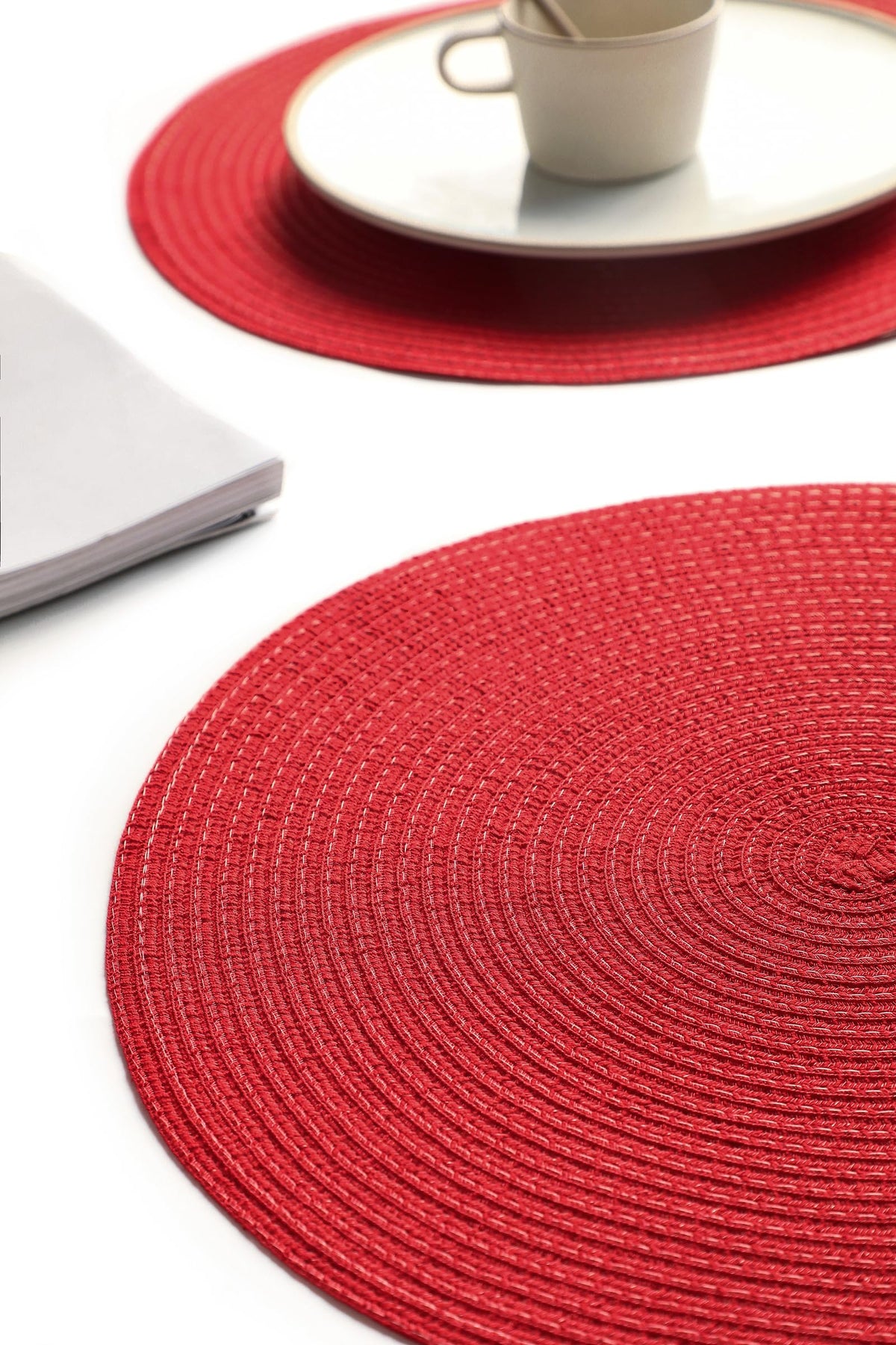 Floroom red holiday placemats add rustic charm to celebrations.