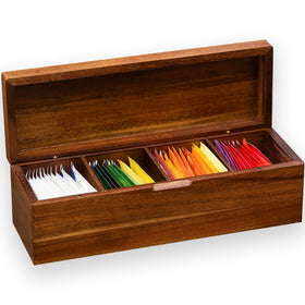 FLYIEE Acacia Tea Bag Organizer with four compartments keeps teabags neatly organized on the counter.