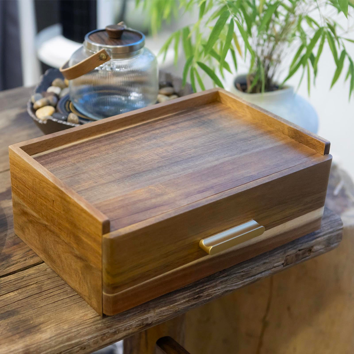 FLYIEE Acacia organizer on countertop offers practical storage and a stylish display.