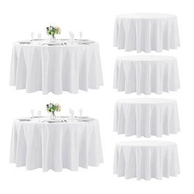 Fokitut 6-pack round tablecloth in white laid for event setup.