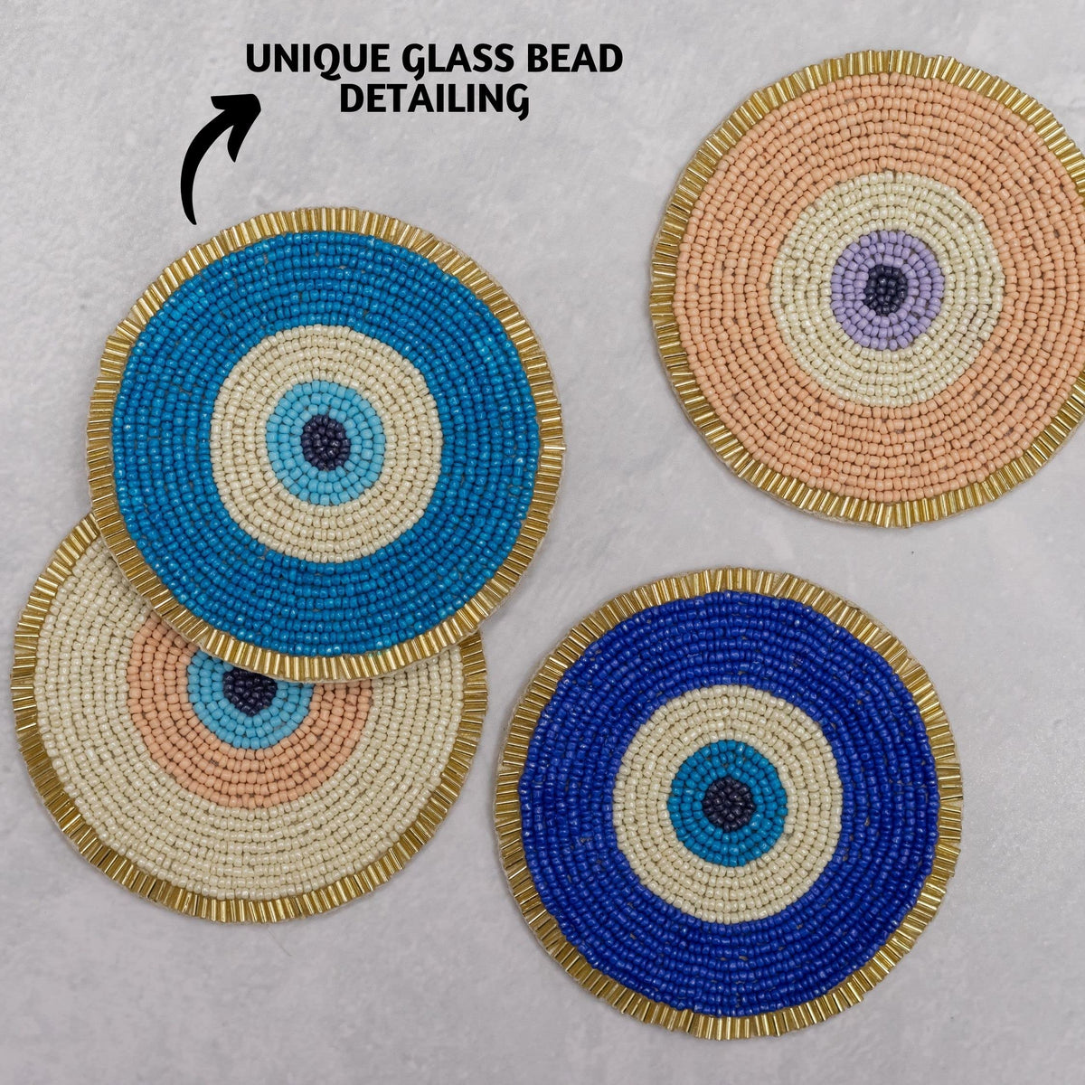 Folkulture coaster set of four in boho gold-tone beads adds elegance.