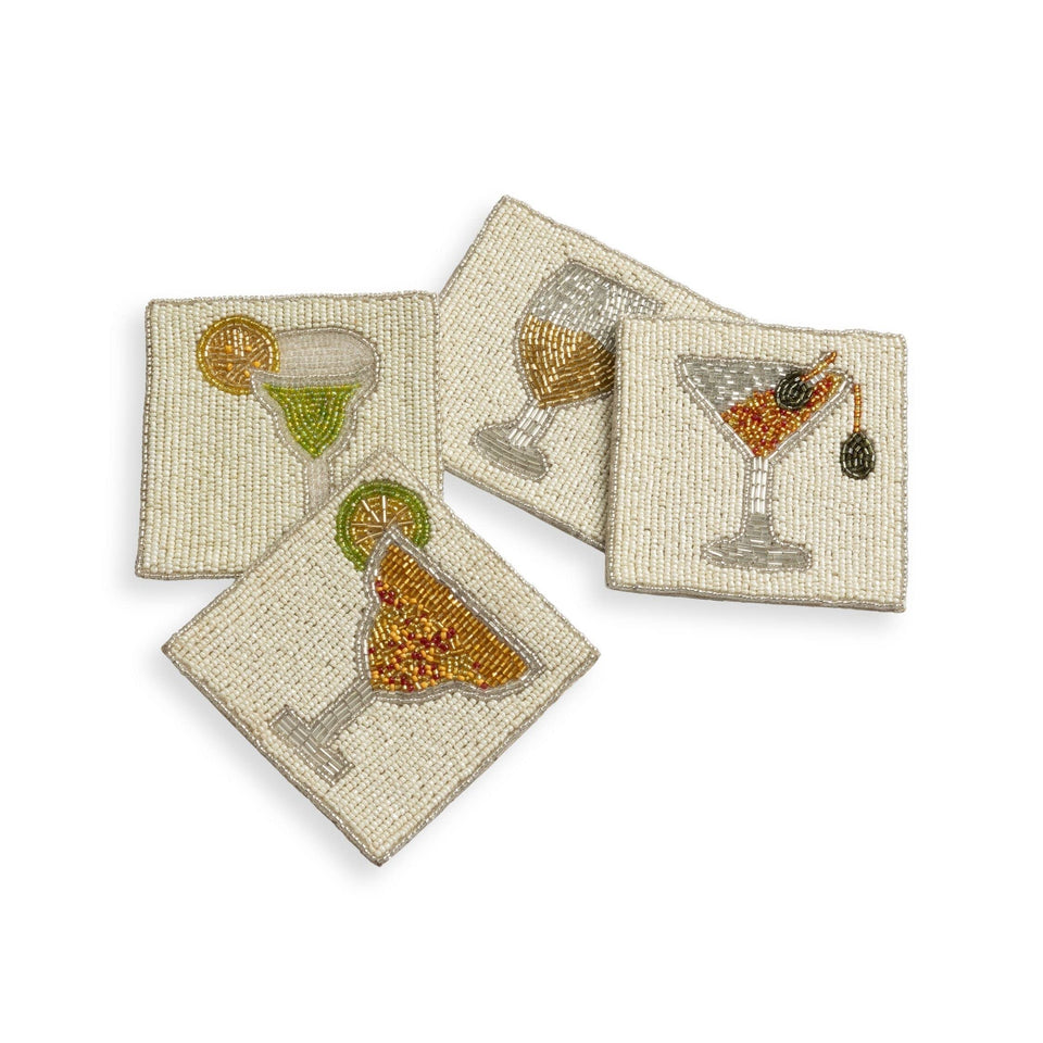 Folkulture coasters with a four-inch diameter featuring beaded boho motif protect surfaces stylishly.