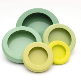 Food Huggers zucchini saver silicone sleeve on half zucchini to preserve freshness