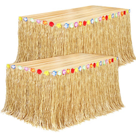Fovths Luau grass table skirt natural draped on a long table for tropical ambience