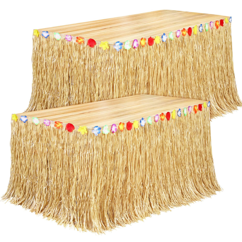 Fovths Luau grass table skirt natural draped on a long table for tropical ambience