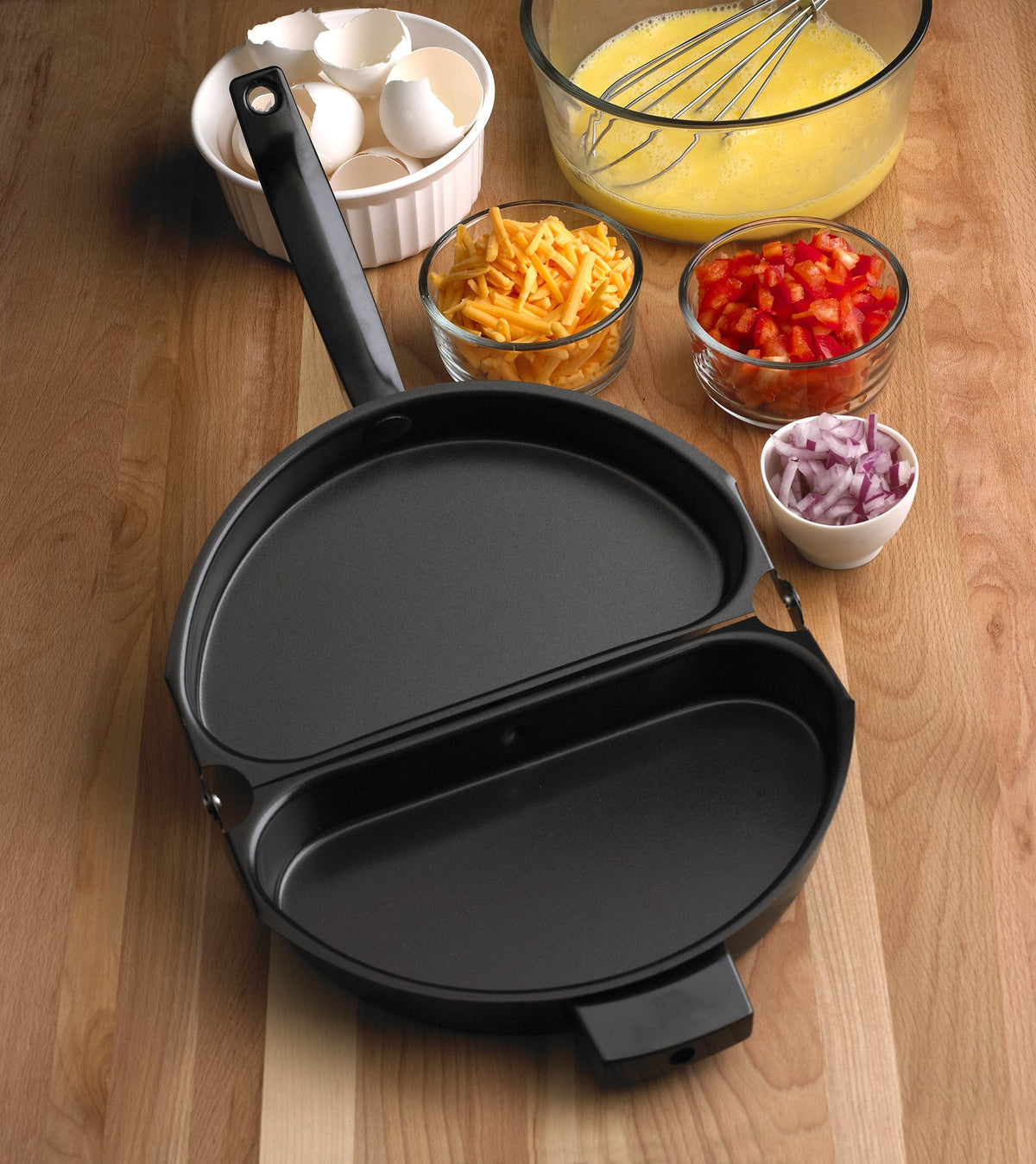 Fox Run egg pan dual-sided design enables cooking two flavors at once