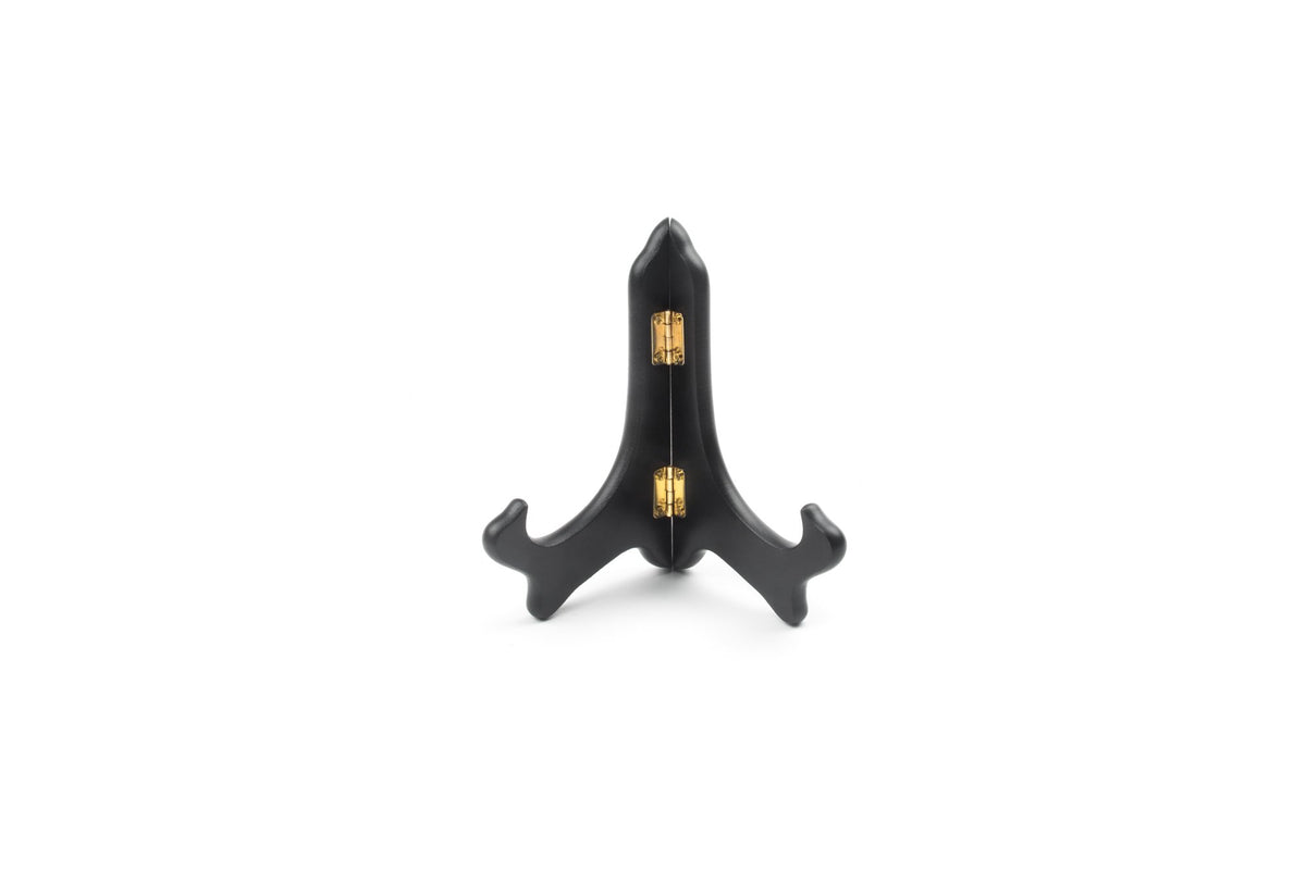Fox Run wooden plate display stand on a shelf showing a decorative plate.