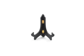 Fox Run wooden plate display stand on a shelf showing a decorative plate.