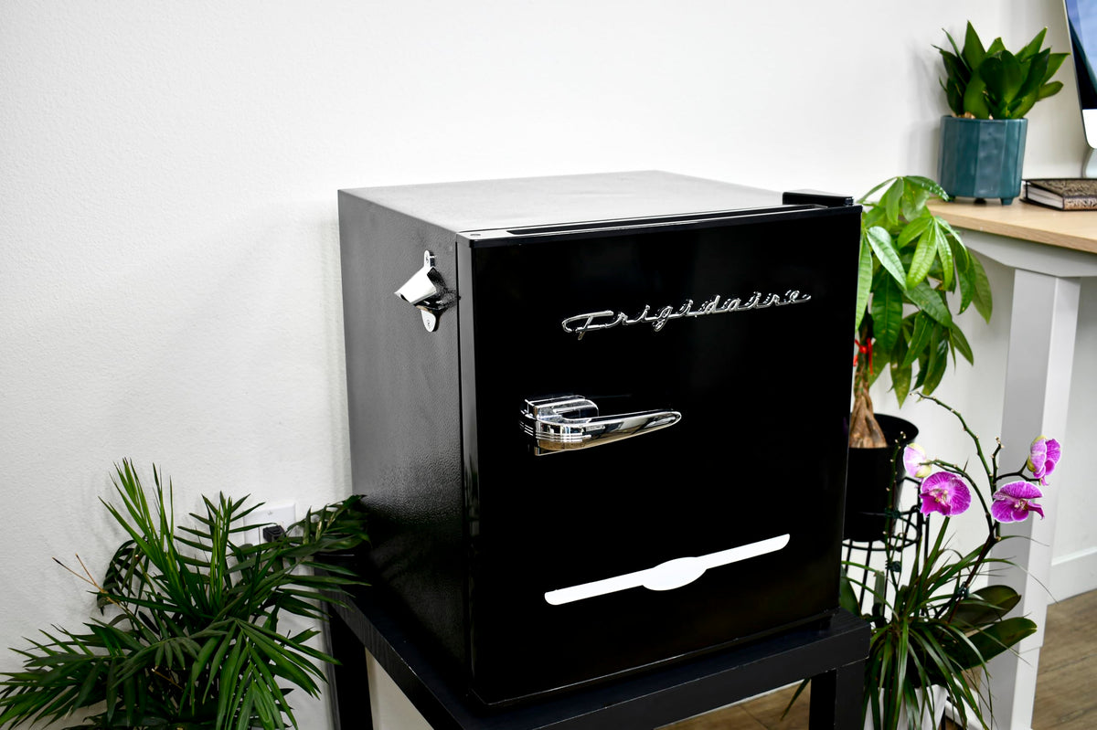 Frigidaire black retro mini fridge interior with slide-out shelves for easy organization.