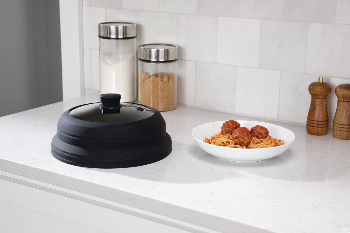Frigidaire Collapsible Microwave Splatter Cover collapsed for compact kitchen storage