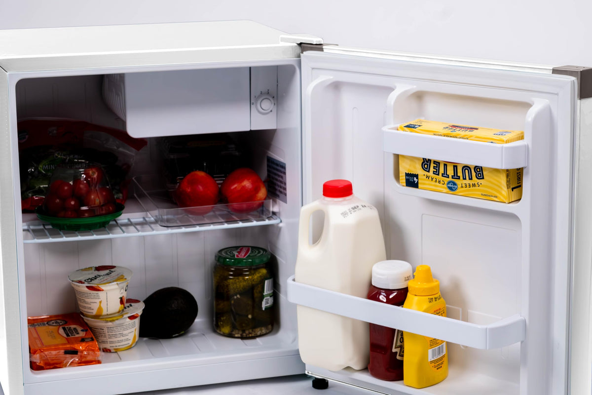 Frigidaire compact fridge in dorm or office setup.