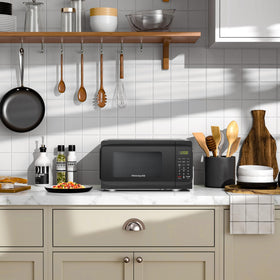 Frigidaire EMW733BLACKAMZ interior cavity demonstrates compact space for quick reheats and snacks.
