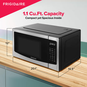Frigidaire microwave with door open showcasing accessible interior and easy cleanup