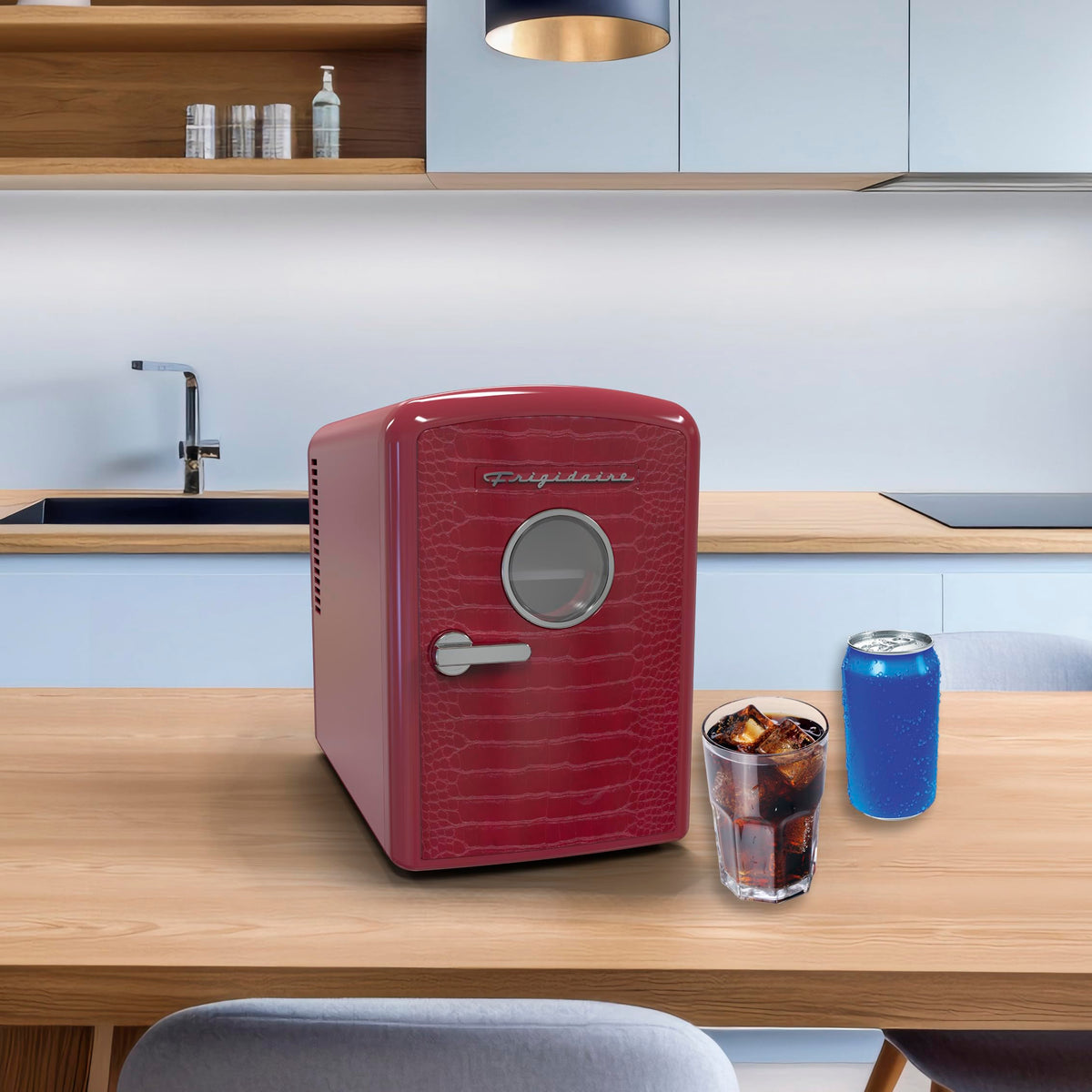 Frigidaire portable mini fridge with handle and locking latch.