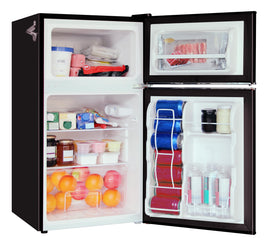 Frigidaire retro mini fridge interior storage shows two glass shelves and a clear crisper bin for produce
