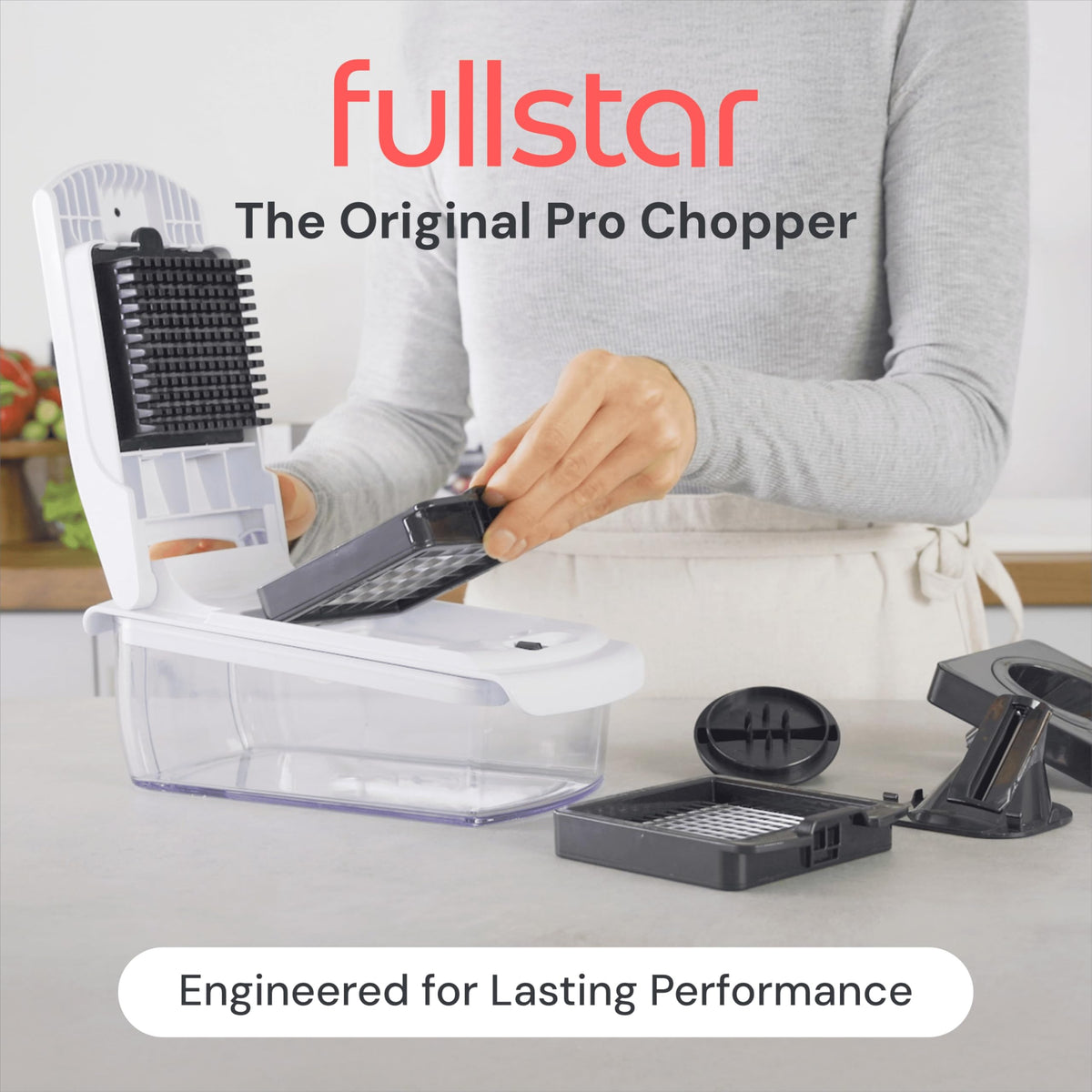 Fullstar vegetable chopper with container and base keeps counters clean and stable.