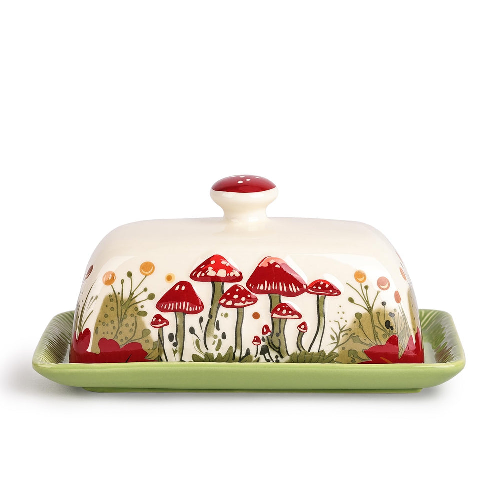 Fungi Fun mushroom butter dish with lid keeps butter fresh on a kitchen counter.
