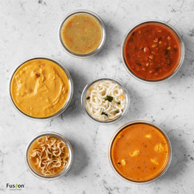 Fusion Gourmet round glass meal-prep containers in use for easy lunches.
